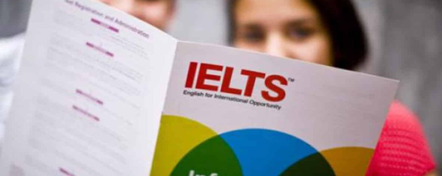 Students looking at IELTS papers.